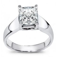 a white gold ring with a princess cut diamond