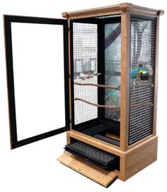 a large bird cage sitting inside of a wooden box