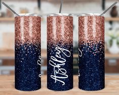 three personalized glitter tumblers with the word cheers on them