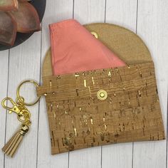 Natural cork and metallic gold Faux leather with snap closure and keychain. Great ID wallet or masker holder, clips right to you keychain or bag 4.25” x 3” Leather Brown Coin Purse With Key Clip, Gold Coin Purse With Interior Key Chain Holder, Leather Wallets With Interior Key Chain Holder, Cork Wallet, Id Wallet, Cork, Burlap Bag, Gold Metal, Reusable Tote Bags