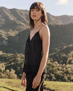 Inspired by a 1920s pajama set, The Legacy Top features embroidered mesh lace at the neckline and hem. Delicate shoulder straps with adjustable sliders ensure a perfect fit. Ideal for layering, let the intricate lace peek through under a cozy sweater. 100% Silk Dry Clean Only Import Black Lace Tops For Summer, Summer Night Out Delicate Lace Camisole, Summer Delicate Lace Camisole For Night Out, Summer Black Lace Camisole, Black Delicate Lace Camisole For Summer, Summer Evening Lace Top With Lace Trim, Summer Evening Lace Top, Spring Night Camisole With Lace Trim, Summer Evening Camisole Sleepwear