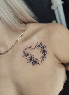 a woman with a tattoo on her chest