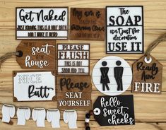 several wooden signs with different sayings on them sitting on a wood table next to paper clips