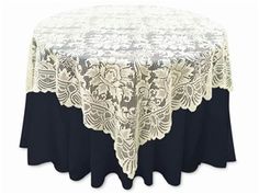 a round table with black and white lace on it