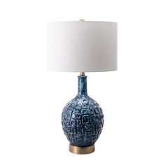 a blue table lamp with a white shade