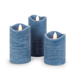 three blue candles sitting next to each other