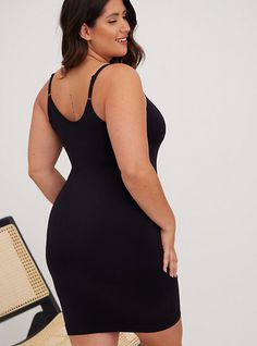 Designed to be worn under anything, our Seamless Smoothing Slip Dress is silky-soft and stretches with your body as it provides moderate smoothing to your everyday looks. A figure-hugging design to seamlessly fit under your garments, while providing moderate smoothing. Scoop neck and back. Adjustable straps. Ribbed hem to help keep from riding up. CONTENT + CARE Nylon/spandex/cotton. Wash cold; dry flat. Imported plus size dresses . SIZE + FIT Model is 5'10”, size 1. Size 2 measures 39” from sho Black Seamless, Black Slip Dress, Deck Ideas, Under Dress, Matches Fashion, Black Slip Ons, Sheer Dress, Google Shopping, I Dress