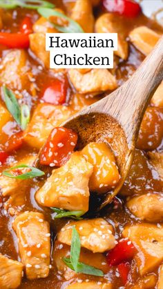 a wooden spoon is stirring some chicken and peppers in a brown sauce with sesame seeds