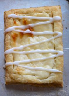 a square pastry with white icing on it