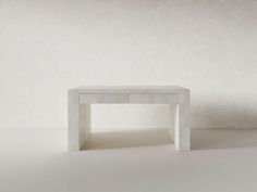 a white table sitting on top of a white floor