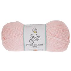 a pink ball of yarn with the words baby bee on it and a white background