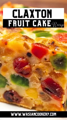 a close up of a slice of fruit cake on a plate with the words, claxton fruit cake ready