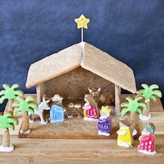 a nativity scene with figurines in the foreground