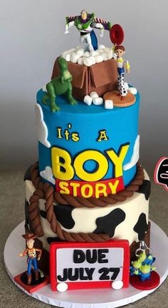 a birthday cake with toy story characters on the top and an advertisement for it's a boy