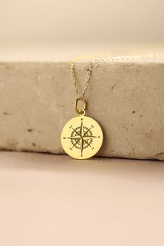 Gold Compass Pendant - Compass Gold Necklace ● Material of pendant: Solid Gold 14k ( REAL GOLD ) ● Metal Stamp: 14k ( REAL GOLD ) ● The pendant is available in 5 sizes: - 12,7 mm / 0.5 inches (Diameter) - 14,0 mm / 0,55 inches ( Diameter ) In the photos - 15,3 mm / 0.6 inches ( Diameter ) - 16,5 mm / 0,65 inches ( Diameter ) - 19,1 mm / 0,75 inches ( Diameter ) ( In the photos the size is 14mm / 0.55 inches Diameter ) ( Jump Ring inner diameter: 4 mm ) ● Material of chain: Solid gold 14k ( REAL Personalized Gold Jewelry For Travel, Gold Compass Design Necklace For Travel, Engraved Medallion Necklace For Travel, Personalized Gold Necklace For Travel, Personalized Pendant Necklaces For Travel, Gold Compass Necklace, Compass Jewelry, North Star Necklace, Custom Pendant