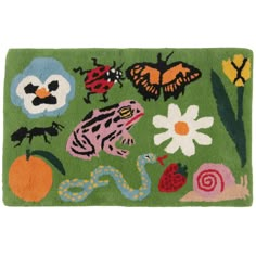 a green rug with bugs and flowers on it