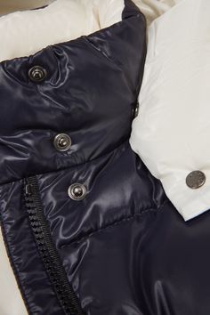 Instantly recognizable, the Parana down jacket is crafted from glossy nylon laqué. Characterized by squared quilting, contrast color lining and a detachable hood, the short puffer is a practical piece that goes from the school yard to the playground. Blue Hooded Puffer Jacket With Detachable Hood, Navy Hooded Puffer Jacket With Pockets, Luxury Hooded Puffer Jacket With Double-lined Hood, Luxury Hooded Outerwear For Outdoor, Luxury Hooded Outerwear With Drawstring, Luxury Blue Hooded Outerwear, Navy Hooded Puffer Jacket For Winter, Navy Hooded Winter Puffer Jacket, Blue Hooded Puffer Jacket With Padded Collar