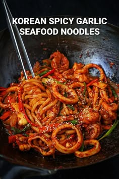 korean spicy garlic seafood noodles in a wok