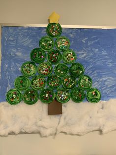 a paper plate christmas tree made to look like buttons