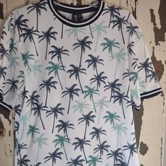 This Lightweight Tee Has A Navy Stripe Around The Crew Neck And The Sleeves. This Nwot Shirt Is 60% Cotton 40% Polyester. Greens And Blues On A White Background. Cotton Crew Neck Top With Palm Tree Print, White Relaxed Fit Palm Tree Print Top, White Relaxed Fit Top With Palm Tree Print, White Cotton Top With Palm Tree Print, Relaxed Cotton Top With Palm Tree Print, White Cotton Palm Tree Print Top, White Palm Tree Print Top With Relaxed Fit, Casual Cotton Tops With Palm Tree Print, Casual Cotton Top With Palm Tree Print