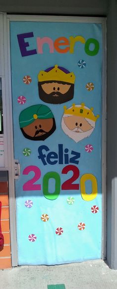 a door with the words enero written on it and pictures of people in crowns