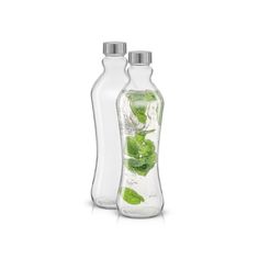 two bottles filled with ice and green leaves