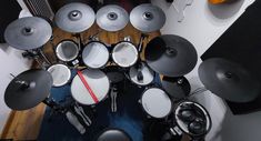 an overhead view of a drum set in a recording studio