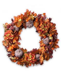 an autumn wreath with pumpkins and leaves