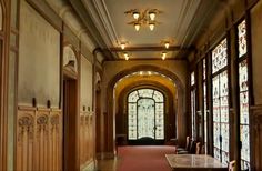 the hallway is lined with stained glass windows