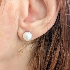 These stud-style earrings, crafted from 14K white gold, are of exceptional quality and elegance. The pearls used are cultured saltwater Akoya pearls, responsibly sourced from Japan. The round shape of the pearls combined with their excellent luster gives them a stunning appearance. They showcase a white color with visible orient, adding to their allure. The pearls' surface is very clean, free from visible inclusions, enhancing their overall beauty. Each piece of our jewelry is unique and individ Classic White Gold Hypoallergenic Pearl Earrings, Classic Hypoallergenic White Gold Pearl Earrings, Hypoallergenic Akoya Pearl Earrings In Classic Style, Classic Hypoallergenic Akoya Pearl Earrings, Hypoallergenic Classic Akoya Pearl Earrings, Classic White Akoya Pearl Earrings, Classic Hypoallergenic Pearl White Pearl Earrings, Hypoallergenic Akoya Pearl Earrings For Anniversary, Classic Akoya Pearl Earrings