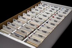 an open file cabinet filled with lots of folders on top of eachother