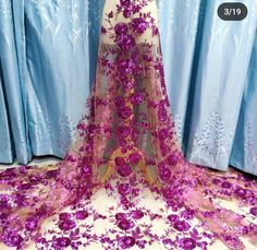 a dress with purple flowers on it