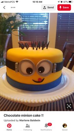 a yellow and blue cake with eyes on it