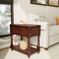 a living room scene with focus on the end table and white sofa in the background