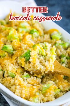 broccoli and rice casserole in a white dish with a wooden spoon