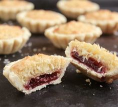 several small pastries on a black surface