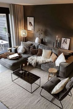 a living room filled with furniture and candles