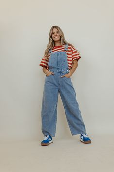 Introducing THE BECKHAM BARREL OVERALLS IN DENIM - the perfect fusion of style and comfort! These barrel jean overalls are not only cute and trendy, but also provide a relaxed fit for all-day wear. Say goodbye to uncomfortable and hello to effortless fashion! Paired with THE OAKLEIGH OVERSIZED STRIPE KNIT TOP IN RUST and THE BOLD SNEAKERS IN BLUE. Adjustable shoulder straps Barrel leg Slouchy fit Pockets 90% cotton 10% polyester Inseam Small: 25.5" Medium: 26" Large: 26.5". True to size with a l Striped Overalls Outfits, Overalls With Sweater, Fun Overalls, Overall Outfits, Overalls Outfits, Striped Overalls, Summer Goddess, Overall Outfit, Overalls Outfit