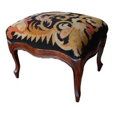 a foot stool with an ornate design on it