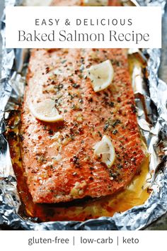 a piece of salmon on foil with lemon slices