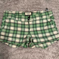 Abercrombie Green Pink Plaid Shorts Nwt Size 10 Fitted Plaid Casual Shorts, Fitted Casual Plaid Shorts, Preppy Shorts With Pockets, Preppy Short-length Bottoms With Pockets, Preppy Plaid Cotton Shorts, Preppy Fitted Cotton Shorts, Abercrombie And Fitch Shorts, Brown Plaid, Plaid Shorts