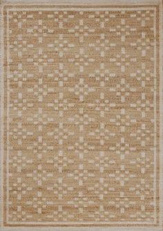 an area rug with squares and dots on the bottom, in neutral colors against a white background