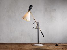 a black and white lamp on a wooden table