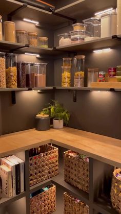 an organized pantry with lots of food in baskets and containers on the shelves, along with other items