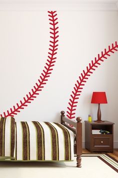 a bedroom with a baseball themed wall decal