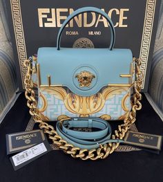 Fendace Fendi X Versace Collaboration La Medusa Turquoise Black Gold Bag High-end Blue Shoulder Bag With Top Carry Handle, High-end Blue Bag With Detachable Handle, Luxury Turquoise Travel Bags, Luxury Turquoise Top Handle Bag, High-end Blue Tote Shoulder Bag, Luxury Turquoise Evening Bag, Luxury Blue Bags With Gold-tone Hardware, Designer Blue Shoulder Bag With Branded Hardware, Fendi X Versace