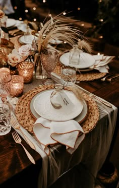 the table is set with plates and silverware