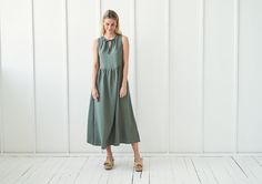 "Summer in a dress. AYLIN is an airy, girly & absolutely delightful piece to wear all year round. FABRIC: 100% softened Lithuanian linen COLOR: Please choose the desired color from the side menu. STYLE: Long sleeveless dress with tie neck detail and side pockets. SIZE CHART (body measurements) : XS Bust 28- 31\" (72- 80 cm) Waist 20- 22.5\" (51- 58 cm) Hips 31.5 -34.5\" (80- 87 cm) S Bust 31.5- 35\" (80- 88 cm) Waist 23- 26.5\" (59- 68 cm) Hips 35- 38\" (88- 96 cm) M Bust 35- 38\" (89- 96 cm Casual Sleeveless Linen Dress With Tie Waist, Sleeveless Linen Dress With Tie Waist, Natural Linen Dress, Linen Wrap Dress, Long Linen Dress, Sleeveless Long Dress, Summer Linen, Sleeveless Dress Summer, Dress With Tie