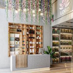 the inside of a store with flowers hanging from the ceiling