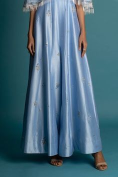 Light blue floor length padded bodice jumpsuit with floral embroidered buttis. Paired with a cape with sequins, cutdana beads embroidery. - Aza Fashions Embellished Bottoms For Wedding, Festive Embellished Bottoms For Wedding, Festive Floor-length Party Bottoms, Blue Maxi Length Party Bottoms, Blue Maxi Length Bottoms For Party, Fitted Bottoms For Party And Eid, Festive Full Length Bottoms For Wedding, Sequin Cape, Silk Cape